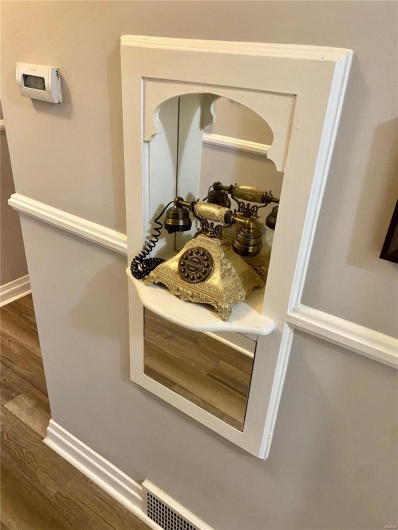 Details with wood finished floors and baseboards