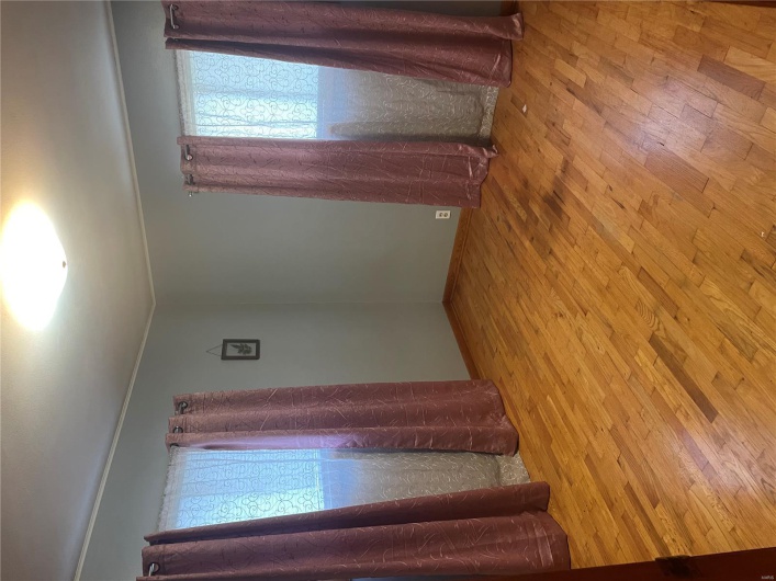 Unfurnished room with wood finished floors