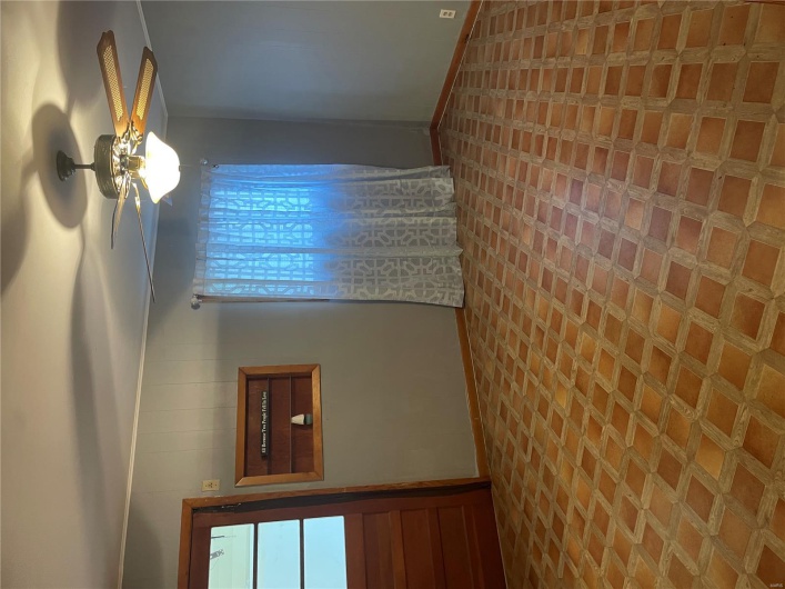 Spare room with a ceiling fan and baseboards