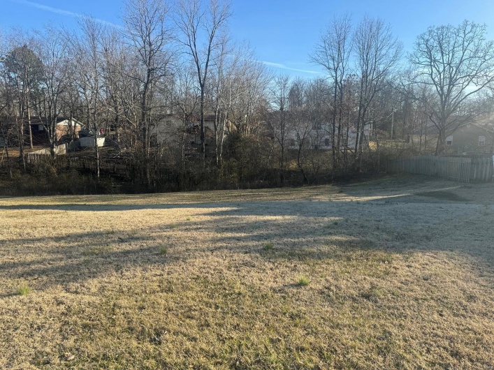 View of yard featuring fence