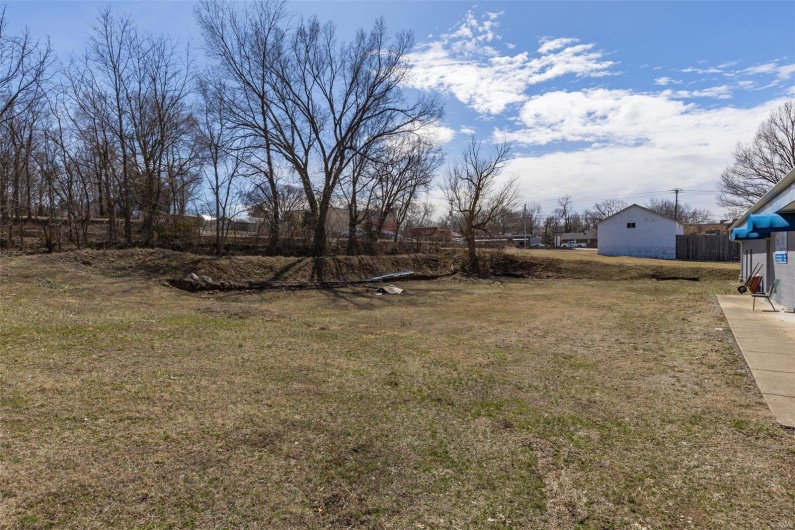 View of yard featuring fence