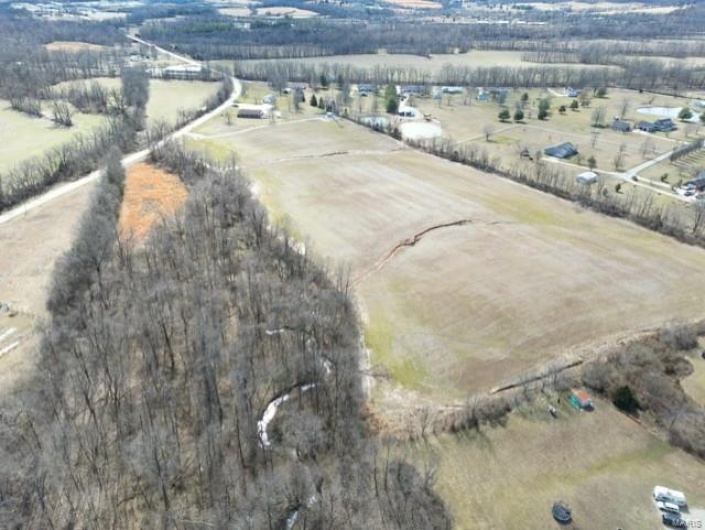 Birds eye view of property with a rural view