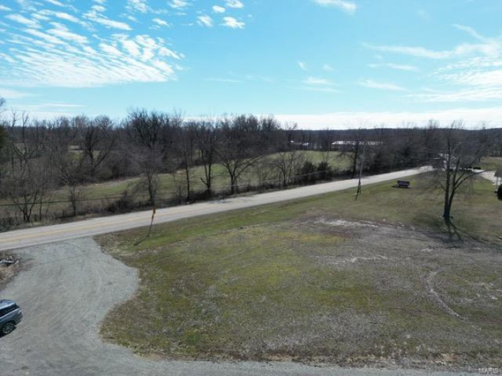View of yard with a rural view