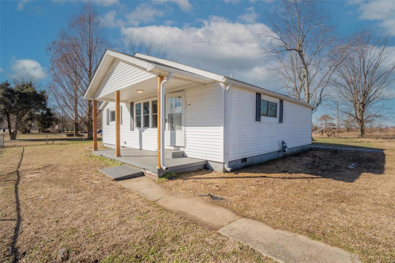 Bungalow-style house featuring covered porch, crawl space, and a front yard