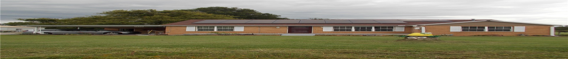 Residential For Sale Ranch-style house with brick siding, an attached carport, and a front lawn