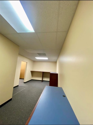 Finished below grade area with a paneled ceiling and baseboards