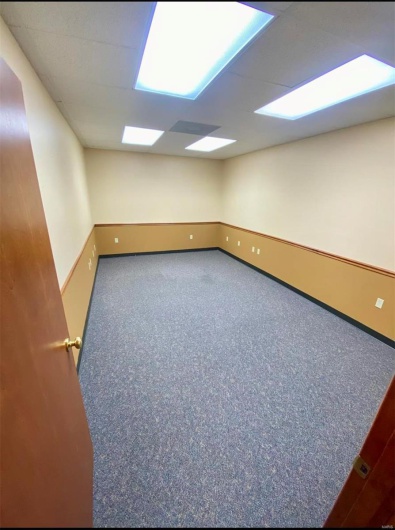 Spare room featuring baseboards