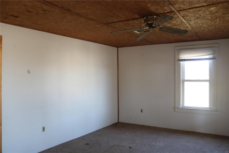Downstairs Living room with ceiling fan