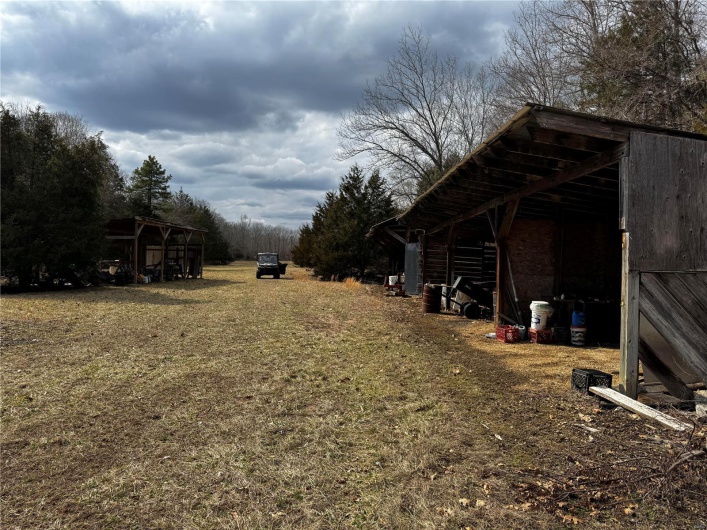 View of yard featuring an outbuilding and an outdoor structure