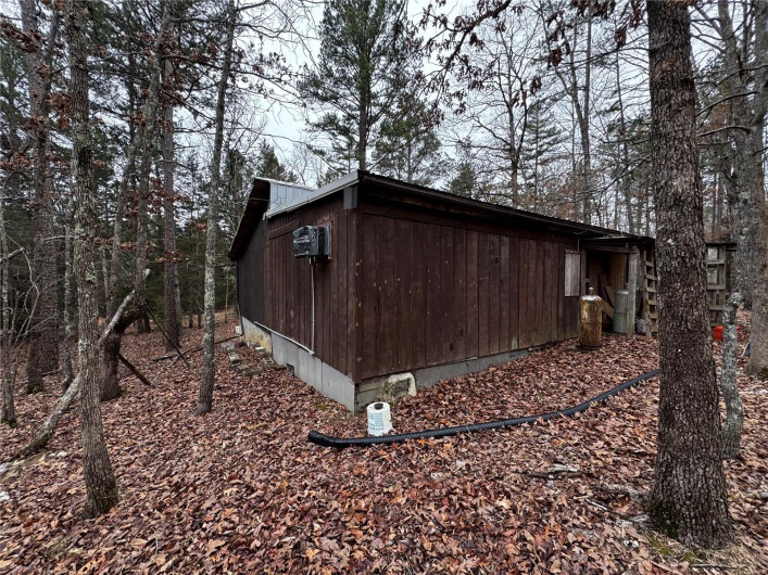 View of side of property featuring metal roof