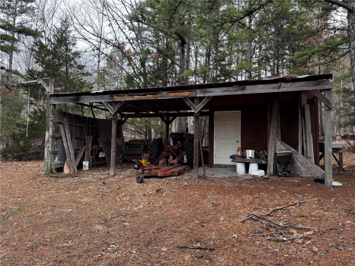 View of outdoor structure featuring an outbuilding