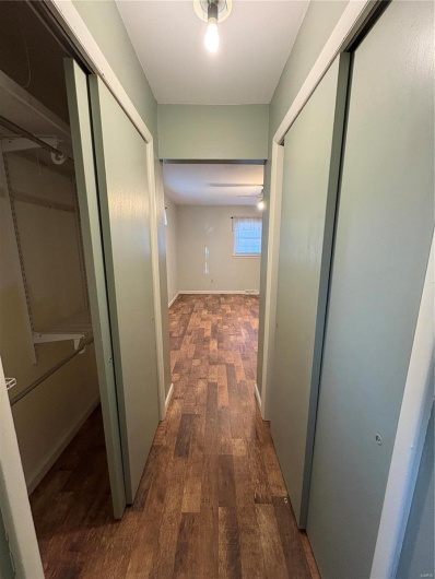 Corridor featuring dark hardwood / wood-style flooring