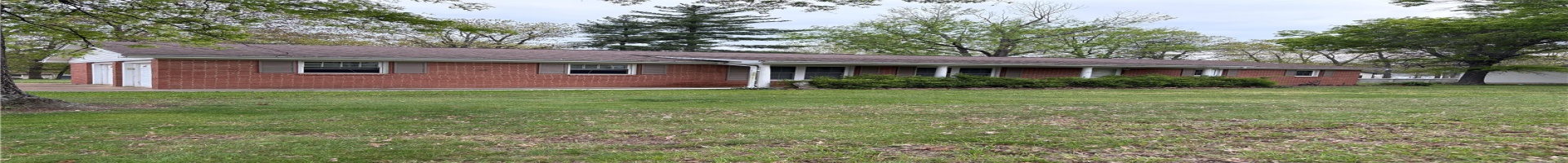 Residential For Sale Single story home featuring a front yard, brick siding, and a garage