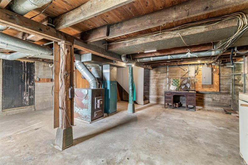 Unfinished below grade area featuring electric panel