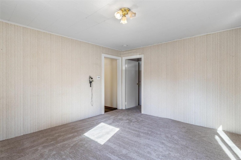 Spare room featuring carpet