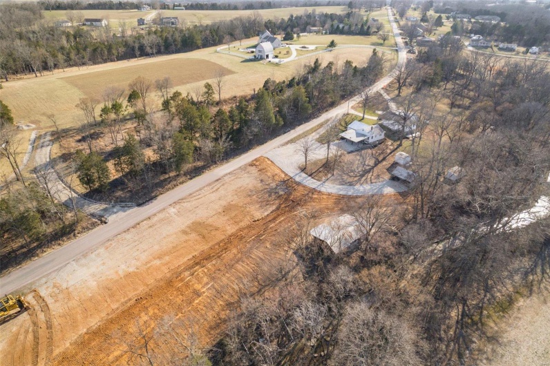Birds eye view of property featuring a rural view