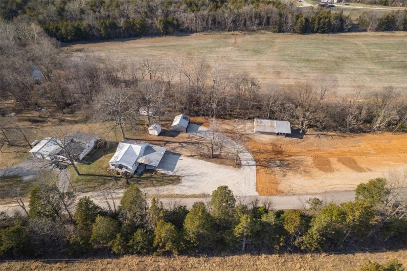 Birds eye view of property featuring a rural view
