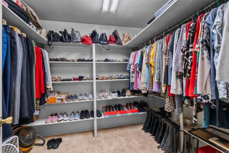 Walk-in primary bedroom closet
