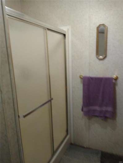 Full bath featuring a stall shower