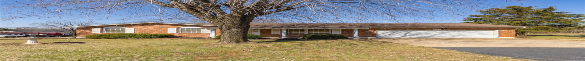 Residential For Sale Ranch-style house featuring brick siding, a front yard, roof with shingles, a garage, and driveway