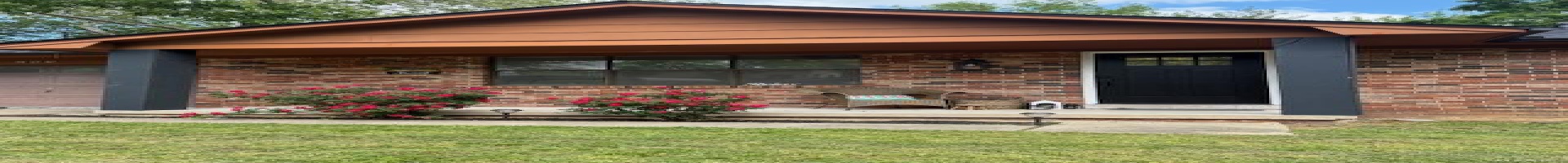 Residential For Sale View of front of home with covered porch, brick siding, an attached garage, and a front lawn