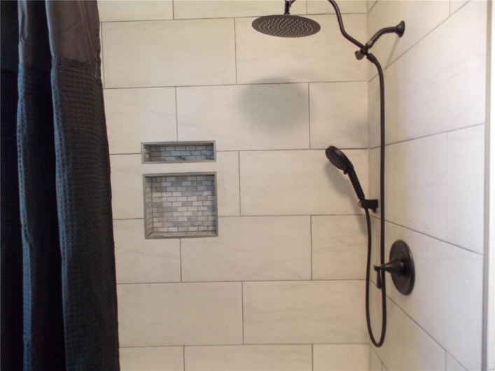 Details with a tile shower