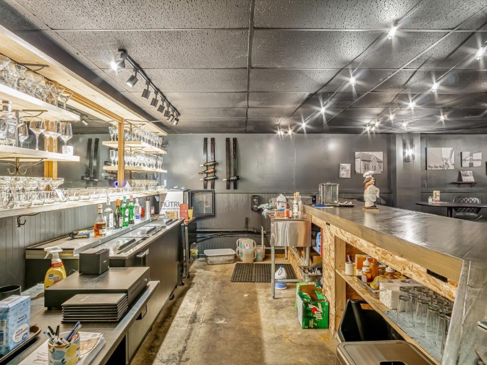 Misc room with concrete flooring and track lighting