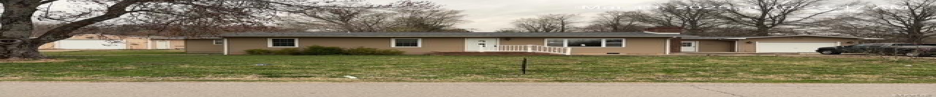 Residential For Sale Ranch-style home featuring a garage, a chimney, and a front lawn