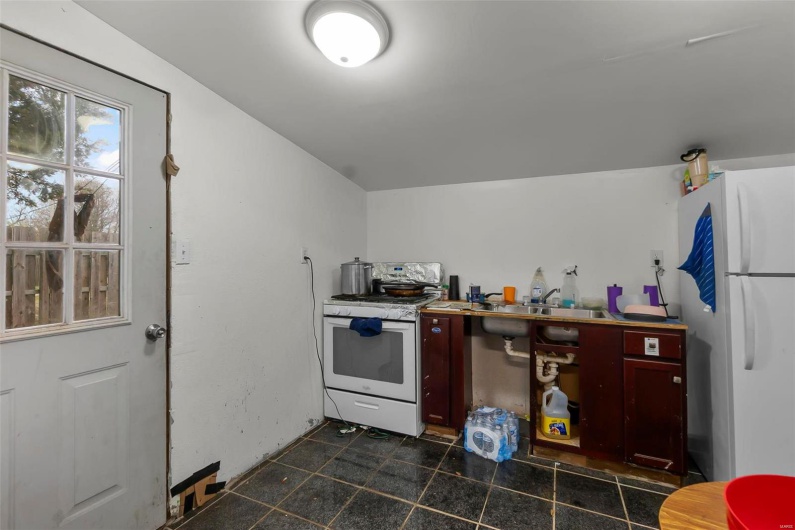Kitchen featuring white appliances