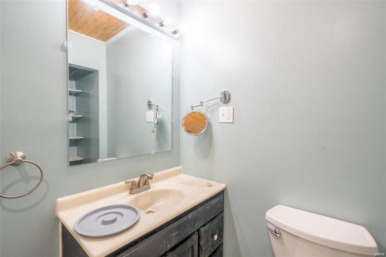 Bathroom with toilet and vanity