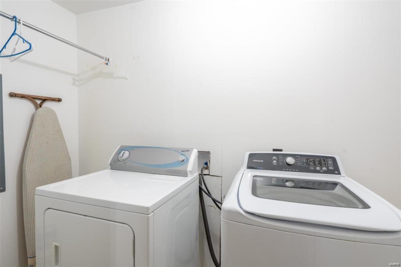 Laundry area with laundry area and washing machine and dryer