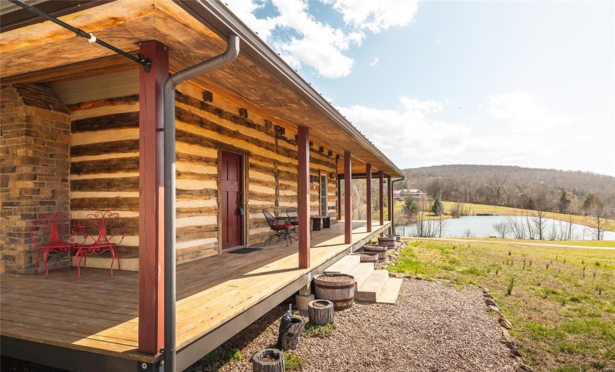 Wooden terrace featuring a water view