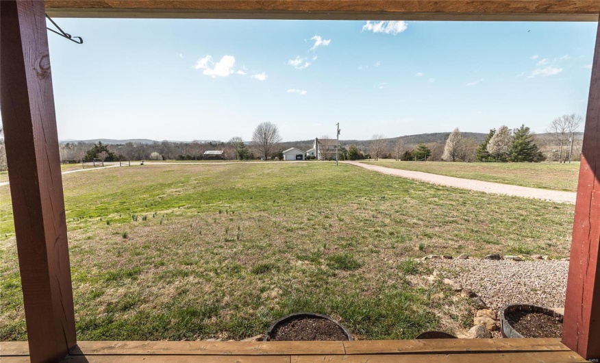 View of yard with a rural view