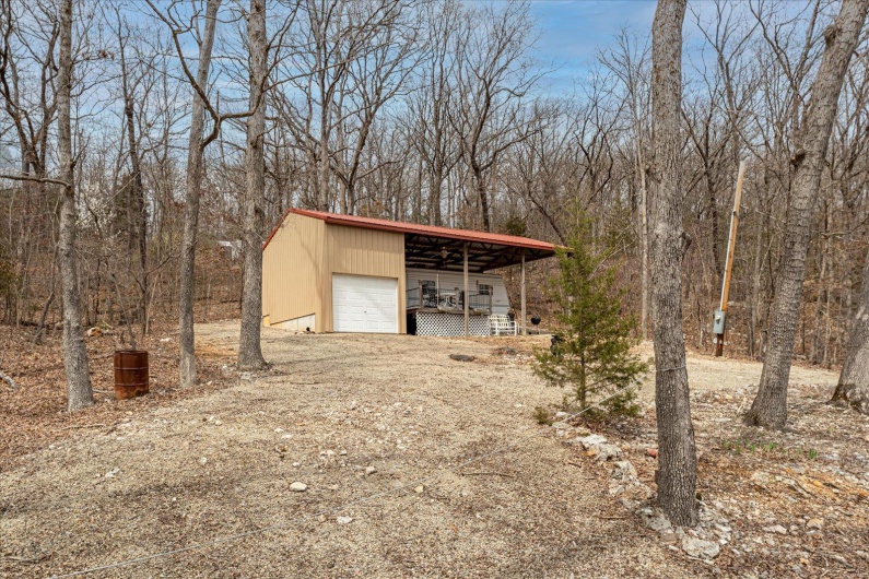 View of outdoor structure featuring an outdoor structure and driveway