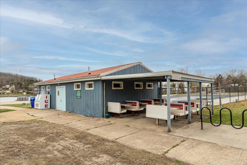 View of outbuilding featuring fence
