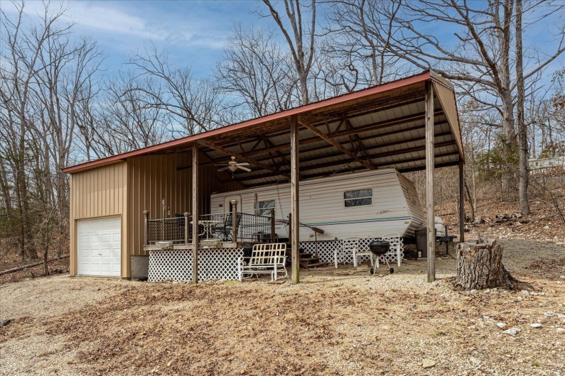 View of outbuilding featuring driveway