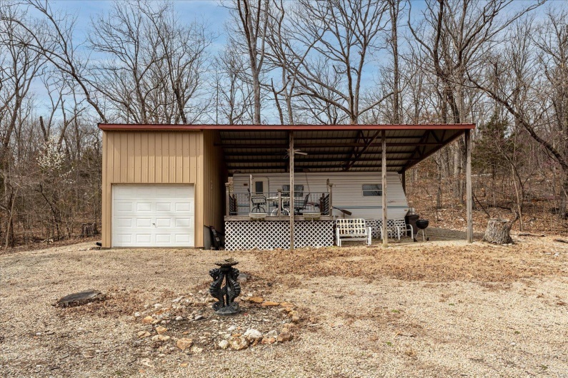 View of outdoor structure featuring a porch