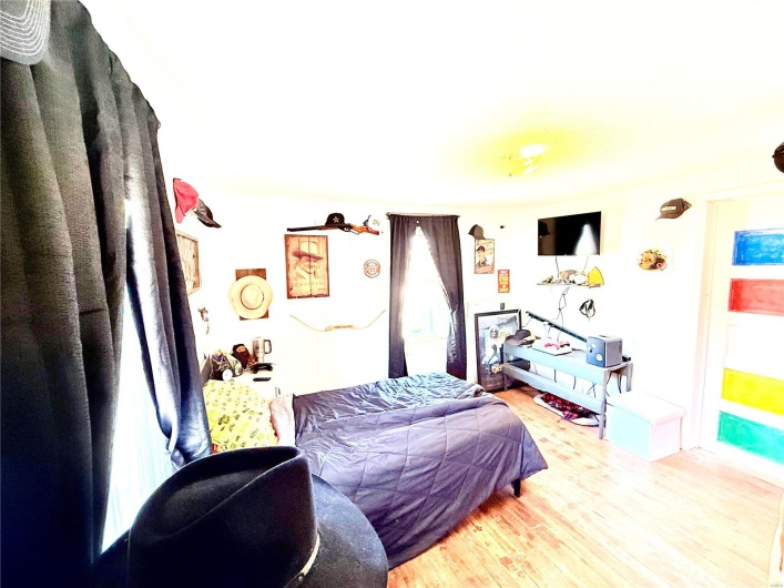 Bedroom featuring wood finished floors