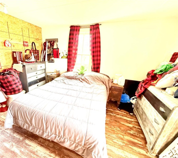 Bedroom with wood finished floors