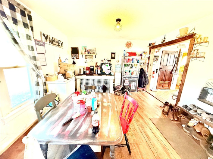 Dining area featuring washer / dryer and wood finished floors