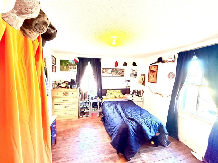 Bedroom featuring hardwood / wood-style flooring