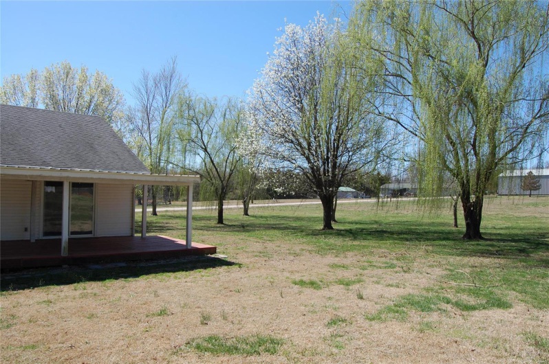 View of yard with a wooden deck