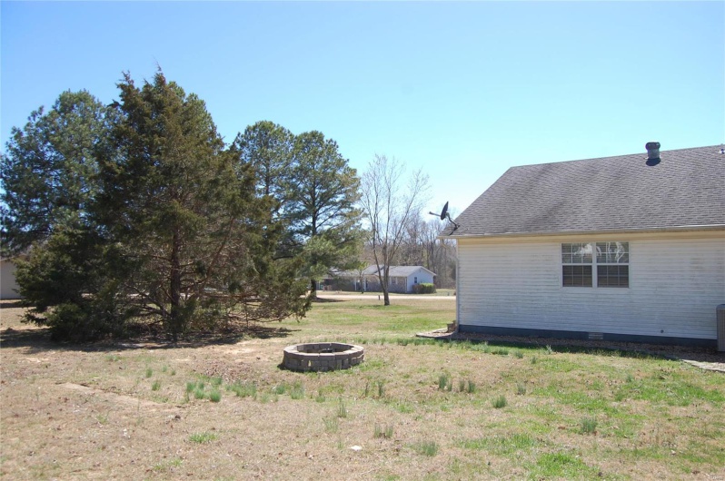 View of yard featuring a fire pit