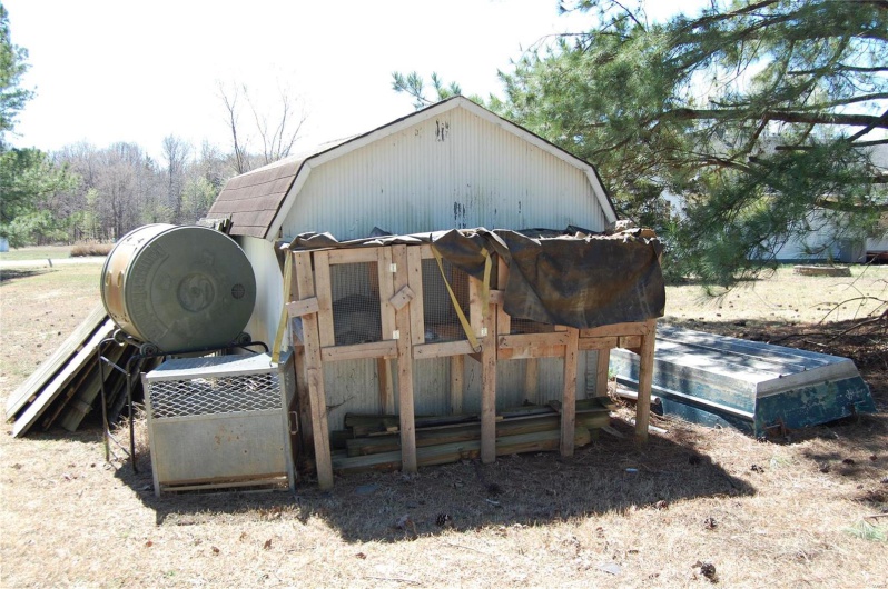 View of outdoor structure featuring an outbuilding