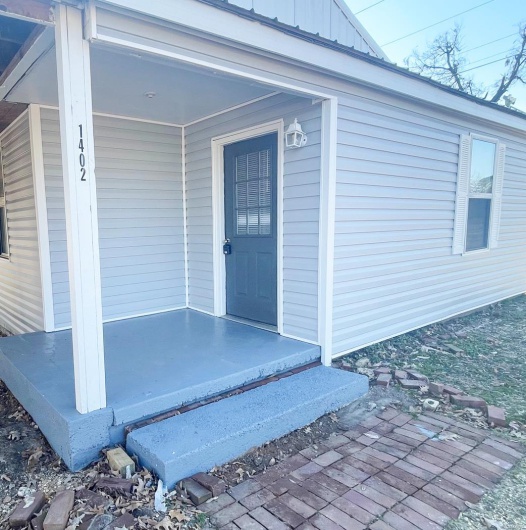 View of exterior entry with board and batten siding