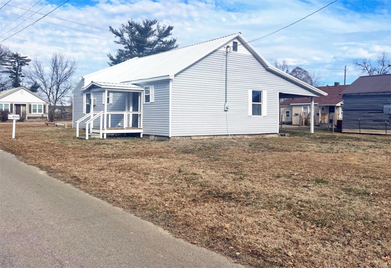 View of side of property with metal roof
