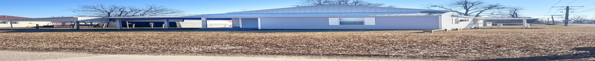 Residential For Sale Rear view of house featuring a carport and metal roof