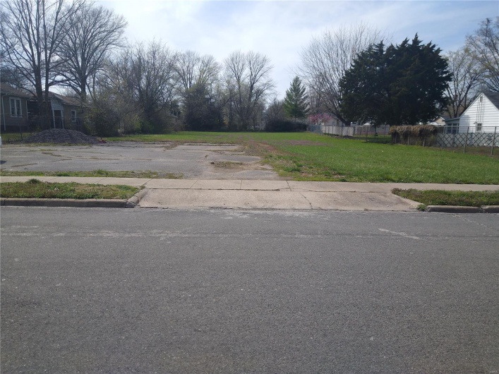 View of road featuring curbs and sidewalks