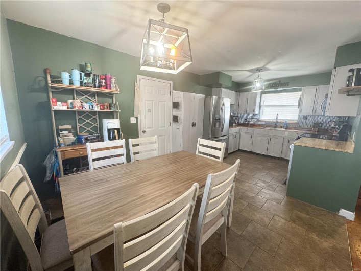 Dining room featuring stone finish flooring
