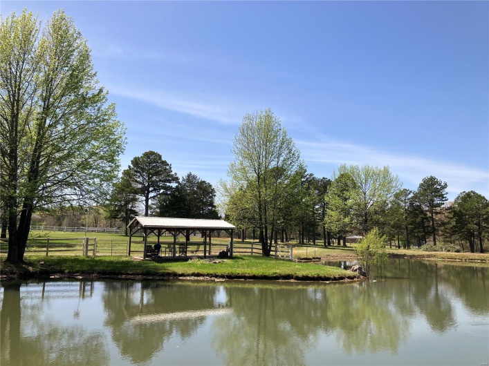 Water view featuring a gazebo and fence